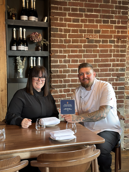 Robert & Donna Taylor, proprietors of Tallow, in Southborough, Kent celebrate being crowned overall winners of The Good Food Guide Best Local Restaurant Award 2023 holding their winner's plaque